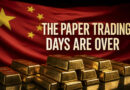 Chinese flag behind gold bars with the words The Paper Trading Days Are Over